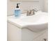 Close up of bathroom sink featuring a soap dispenser at 16121 Wrights Ferry Rd, Charlotte, NC 28278