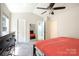 Bright bedroom with a neutral color palette, featuring carpeted floors and multiple doorways at 16121 Wrights Ferry Rd, Charlotte, NC 28278