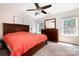 Spacious bedroom with a large bed, dresser, carpet flooring, and ample natural light at 16121 Wrights Ferry Rd, Charlotte, NC 28278