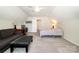 Large bedroom with a couch, desk, and bed, creating a versatile living space at 16121 Wrights Ferry Rd, Charlotte, NC 28278