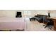 A multi-purpose bedroom with a bed, comfortable seating, and a dedicated work desk area at 16121 Wrights Ferry Rd, Charlotte, NC 28278