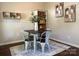 Dining area features a wooden table, metal chairs, and modern decor at 16121 Wrights Ferry Rd, Charlotte, NC 28278