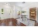 Open dining area features a metal table set, decor, hardwood floors, and a window at 16121 Wrights Ferry Rd, Charlotte, NC 28278