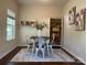 Dining area featuring a table with four chairs and shelving for storage and display at 16121 Wrights Ferry Rd, Charlotte, NC 28278