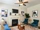 Bright living room with fireplace, a blue sofa, and matching armchairs at 16121 Wrights Ferry Rd, Charlotte, NC 28278