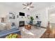 Well-lit living room with a fireplace, hardwood floors, and stylish decor at 16121 Wrights Ferry Rd, Charlotte, NC 28278