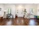 Bright open floor plan featuring hardwood floors, large windows, and a bright white entrance way at 16121 Wrights Ferry Rd, Charlotte, NC 28278