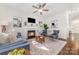 Well-lit living room with a fireplace, hardwood floors, and stylish decor at 16121 Wrights Ferry Rd, Charlotte, NC 28278
