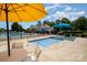 Community pool area with a splash pad and lounge chairs under a sunny sky, ideal for summer relaxation at 16121 Wrights Ferry Rd, Charlotte, NC 28278