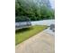 Fenced backyard with grass, a trampoline, a patio, and some mature trees at 1647 Backcreek Ln, Gastonia, NC 28054