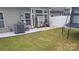 A private backyard with a patio, lawn, and white fence offers room for outdoor enjoyment at 1647 Backcreek Ln, Gastonia, NC 28054