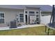 View of home's backyard featuring patio, lawn, AC unit, and white fencing at 1647 Backcreek Ln, Gastonia, NC 28054