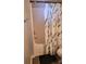 Bathroom features a shower with modern fixtures and a stylish shower curtain at 1647 Backcreek Ln, Gastonia, NC 28054