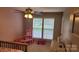 Bright bedroom featuring a ceiling fan, natural light, and neutral-toned walls at 1647 Backcreek Ln, Gastonia, NC 28054