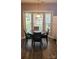 Cozy breakfast nook featuring a round table, four chairs, and a bay window with natural light at 1647 Backcreek Ln, Gastonia, NC 28054