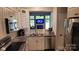 Modern kitchen with stainless steel appliances, white cabinets, granite counters, and a view to the living room at 1647 Backcreek Ln, Gastonia, NC 28054
