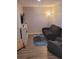 Cozy living room featuring a sofa, armchair, TV, and playful decor at 1647 Backcreek Ln, Gastonia, NC 28054