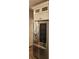 Modern stainless steel LG refrigerator with a glass door, seamlessly integrated with white cabinets at 1647 Backcreek Ln, Gastonia, NC 28054