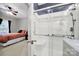Renovated bathroom with glass-enclosed shower and grab bars for accessibility at 16714 Hammock Creek Pl, Charlotte, NC 28278