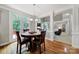 Bright dining area features wood floors, round table, and access to the outdoor deck at 16714 Hammock Creek Pl, Charlotte, NC 28278
