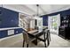 Dining room featuring an elegant table, bright windows, modern lighting and stylish decor at 16714 Hammock Creek Pl, Charlotte, NC 28278
