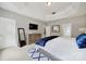 Relaxing main bedroom boasts neutral walls, a tray ceiling, and an ensuite bath at 16714 Hammock Creek Pl, Charlotte, NC 28278
