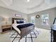 Spacious main bedroom features a tray ceiling, a large window, and a striking accent rug at 16714 Hammock Creek Pl, Charlotte, NC 28278