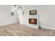 This finished basement has a cozy fireplace and durable laminate floors at 1734 Seifert Cir, Charlotte, NC 28205