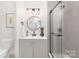 Modern bathroom with stylish vanity, shower, and contemporary lighting at 1734 Seifert Cir, Charlotte, NC 28205