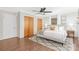 This spacious bedroom features hardwood floors, a ceiling fan, and plenty of natural light at 1734 Seifert Cir, Charlotte, NC 28205