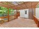 Wooden deck with a pergola and view of backyard and white door at 1734 Seifert Cir, Charlotte, NC 28205