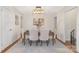 Bright dining room with seating for six, modern light fixture, and neutral decor at 1734 Seifert Cir, Charlotte, NC 28205