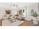 Cozy living room with hardwood floors, ample natural light, and stylish furniture at 1734 Seifert Cir, Charlotte, NC 28205