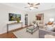 Bright living room featuring hardwood floors, neutral colors, and modern decor at 1734 Seifert Cir, Charlotte, NC 28205