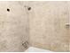 Close-up of a neutral colored tiled shower at 1734 Seifert Cir, Charlotte, NC 28205
