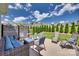 Enjoy this beautiful backyard on the wood deck with comfortable seating overlooking the well-maintained lawn and landscaping at 18013 Grey Mossrun Dr, Charlotte, NC 28278