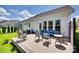 This backyard deck is perfect for relaxing, with a seating arrangement and manicured lawn in a great neighborhood at 18013 Grey Mossrun Dr, Charlotte, NC 28278