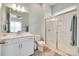 Bathroom with a glass-enclosed shower, modern vanity, and stone flooring at 18013 Grey Mossrun Dr, Charlotte, NC 28278