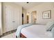 Bedroom with a walk in closet, plush bedding, and cool tones at 18013 Grey Mossrun Dr, Charlotte, NC 28278