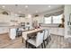 Dining table and chairs with view of kitchen featuring a large island and seating at 18013 Grey Mossrun Dr, Charlotte, NC 28278