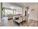 Open-concept dining area with wood floors and easy access to the living room at 18013 Grey Mossrun Dr, Charlotte, NC 28278