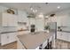 Modern kitchen with a large center island, stainless steel appliances, and pendant lighting at 18013 Grey Mossrun Dr, Charlotte, NC 28278