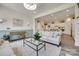 Bright living room with comfortable seating, stylish decor, and open view to the kitchen area at 18013 Grey Mossrun Dr, Charlotte, NC 28278