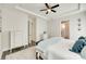 A secondary view of the stylish main bedroom shows lots of natural light and ensuite bath at 18013 Grey Mossrun Dr, Charlotte, NC 28278