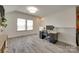 A view of the office space featuring lots of natural light, hard surface floors, and neutral colors at 18013 Grey Mossrun Dr, Charlotte, NC 28278