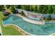 Aerial view of the Palasides neighborhood entrance, featuring a stunning water feature and manicured landscaping at 18013 Grey Mossrun Dr, Charlotte, NC 28278
