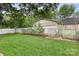 A lush backyard with a white picket fence and well-maintained lawn at 215 S Shaver St, Salisbury, NC 28144