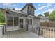 Charming backyard view showcasing the deck and screened in porch, creating an inviting outdoor living space at 215 S Shaver St, Salisbury, NC 28144