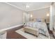 Serene bedroom boasts hardwood floors, natural lighting, and a cozy atmosphere at 215 S Shaver St, Salisbury, NC 28144