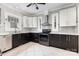 Modern kitchen featuring sleek cabinets, stainless steel appliances, and tile flooring at 215 S Shaver St, Salisbury, NC 28144